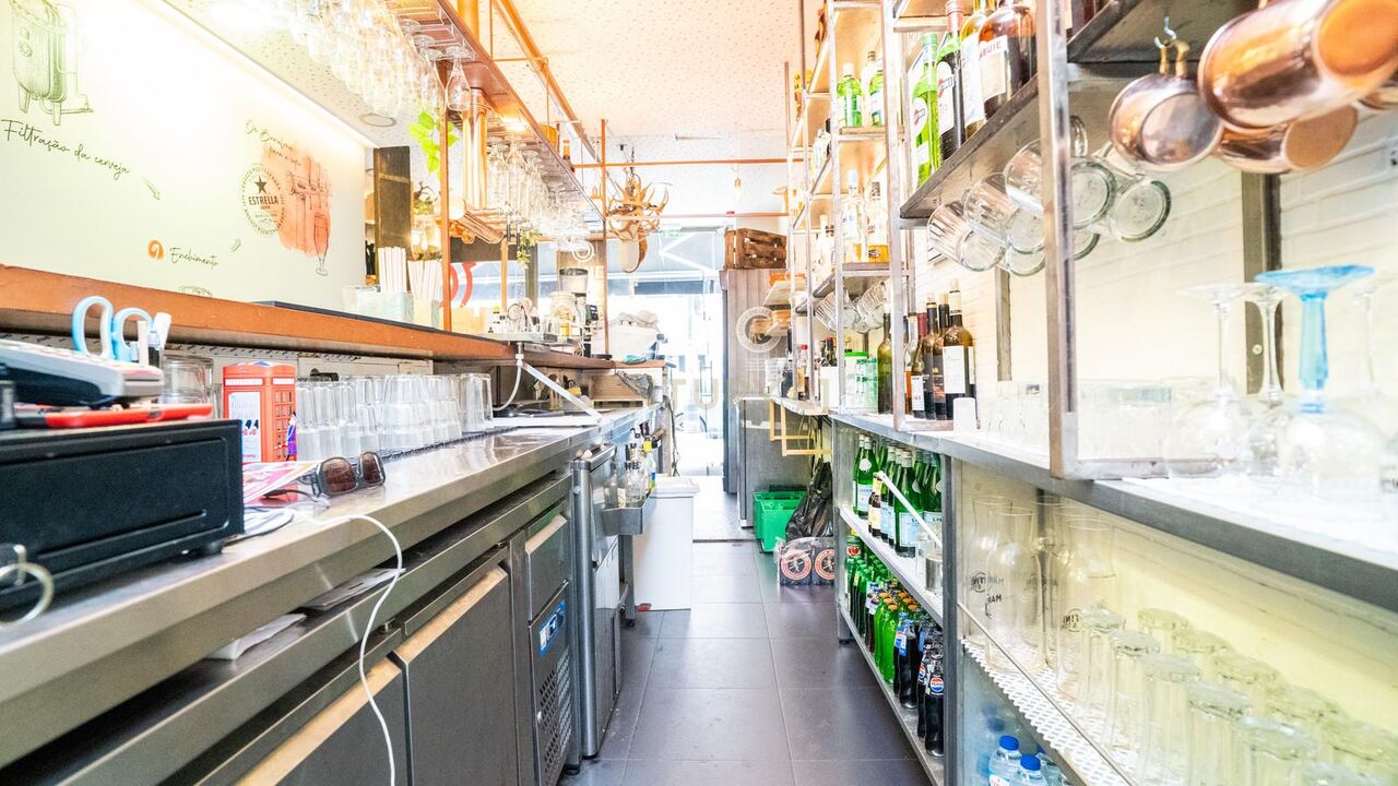 Service area behind the bar with glass racks and a coffee station