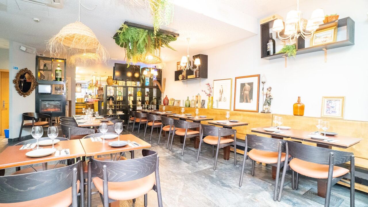 Dining room tables laid for service, view towards the bar
