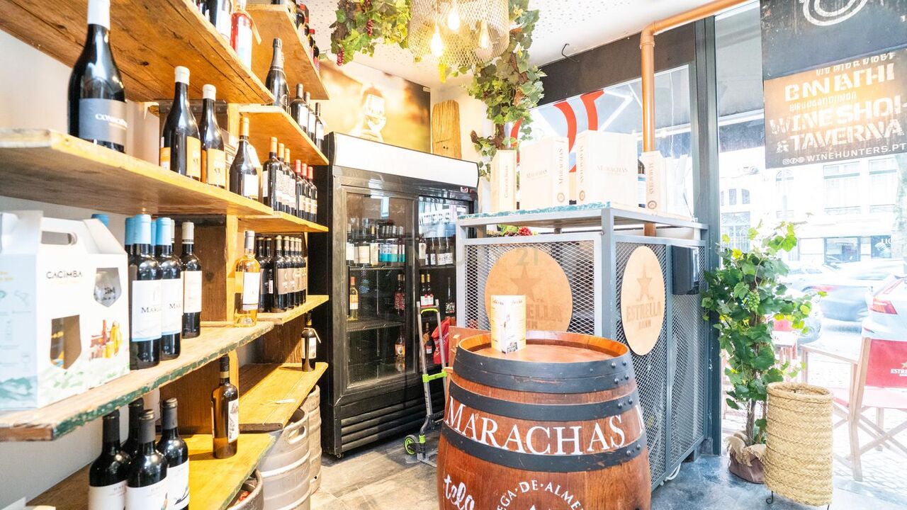 Wine shop shelves and a barrel at the Wine Hunters entrance